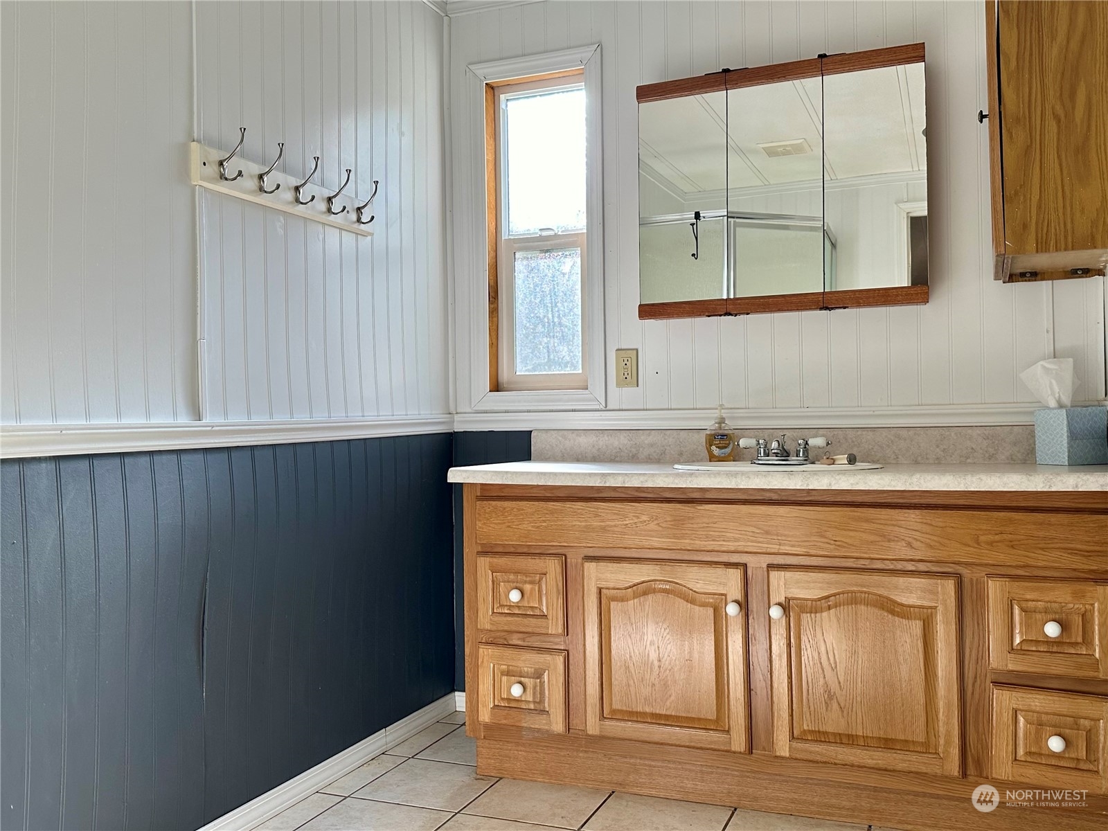 230 Salmon Drive Forks, WA 98331 - Photo 22 of 35 a bathroom with a sink a vanity and a mirror