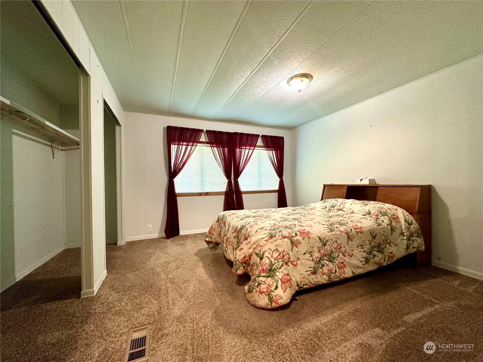 230 Salmon Drive Forks, WA 98331 - Photo 25 of 35 a bedroom with a bed and a large window