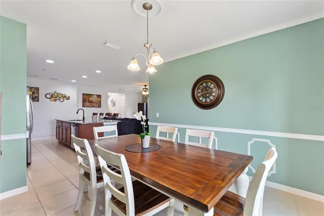 a view of a dining room and a table and chairs