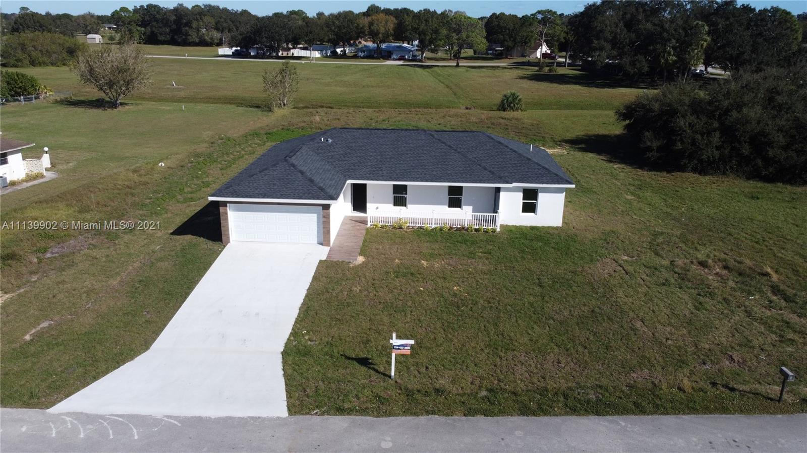 417 Cherry Tree Drive Sebring, FL 33876 - Photo 13 of 39 aerial view of a house with a yard