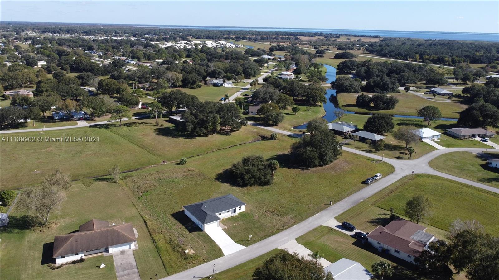 417 Cherry Tree Drive Sebring, FL 33876 - Photo 16 of 39 an aerial view of residential houses with outdoor space