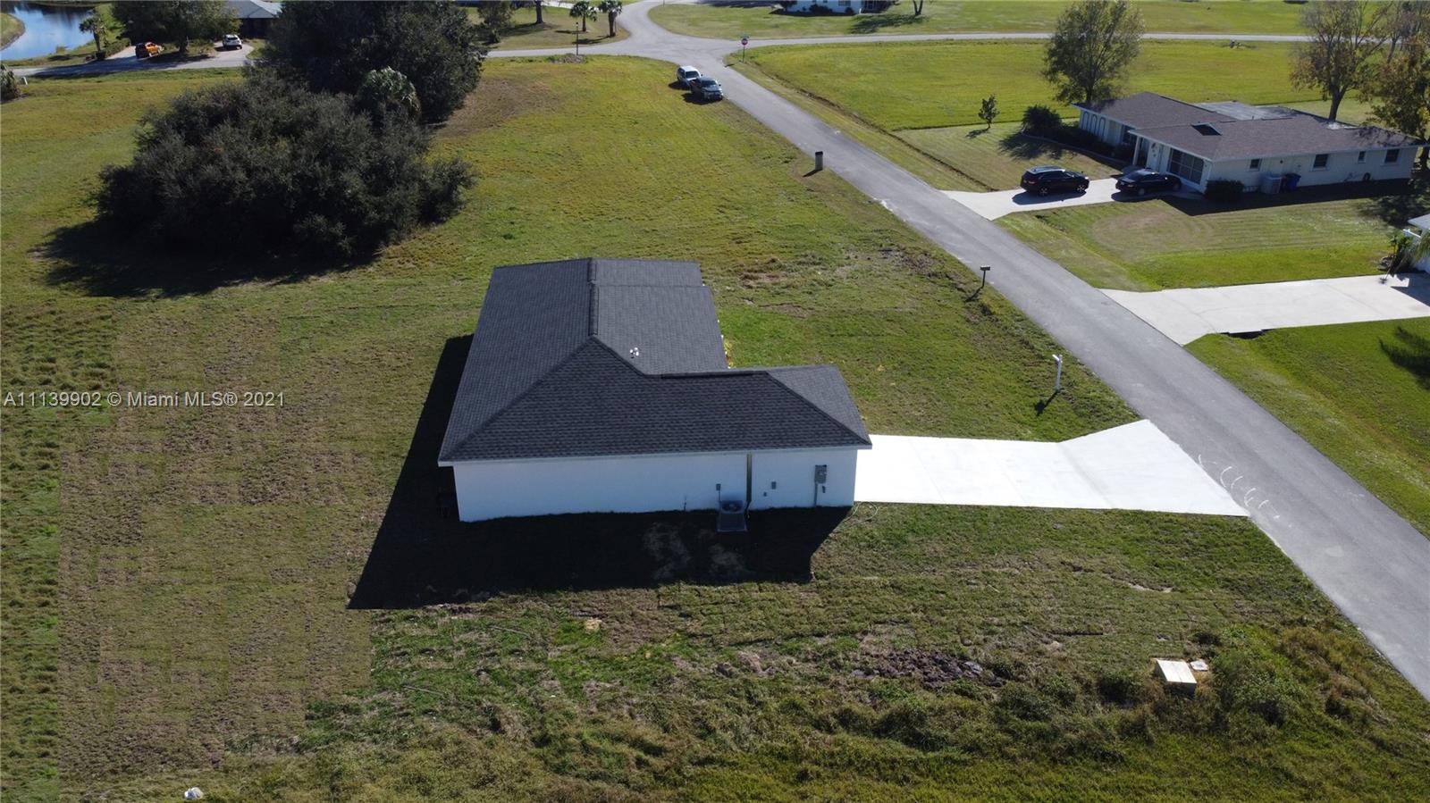 417 Cherry Tree Drive Sebring, FL 33876 - Photo 17 of 39 a view of a back yard of the house