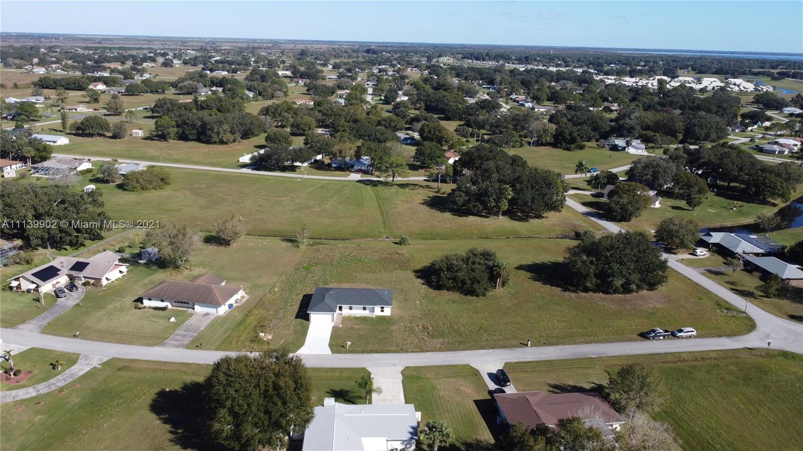 417 Cherry Tree Drive Sebring, FL 33876 - Photo 18 of 39 an aerial view of a house with a yard
