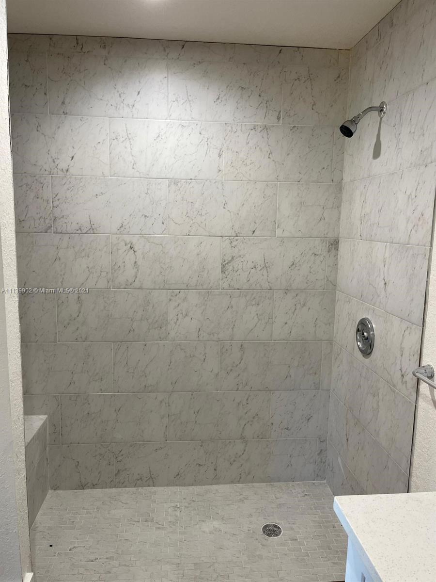 417 Cherry Tree Drive Sebring, FL 33876 - Photo 29 of 39 a bathroom with a shower