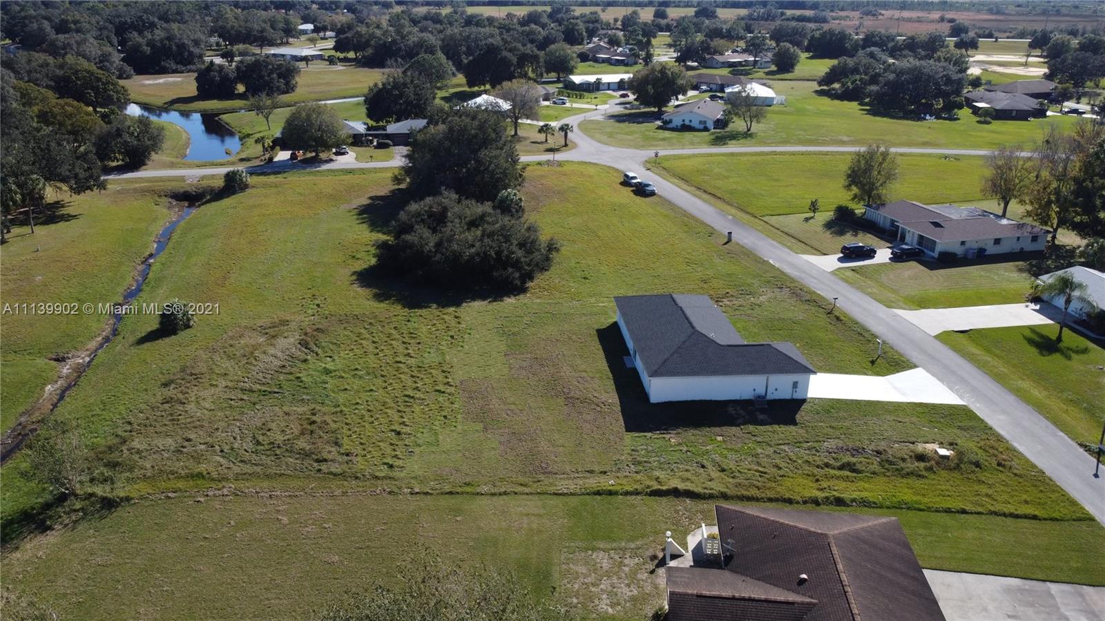 417 Cherry Tree Drive Sebring, FL 33876 - Photo 10 of 39 an aerial view of a house with a garden