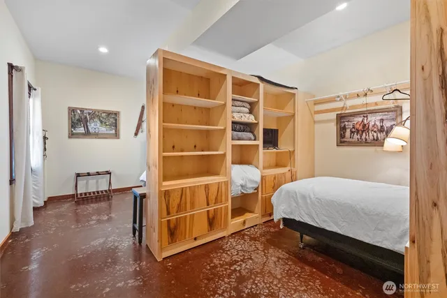 a bedroom with a bed and a cabinets