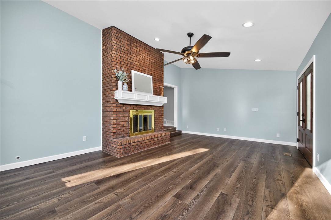 4747 Fawnwood Road Dayton, OH 45429 - Photo 19 of 58 Warm and inviting living space with an eye-catching brick fireplace.