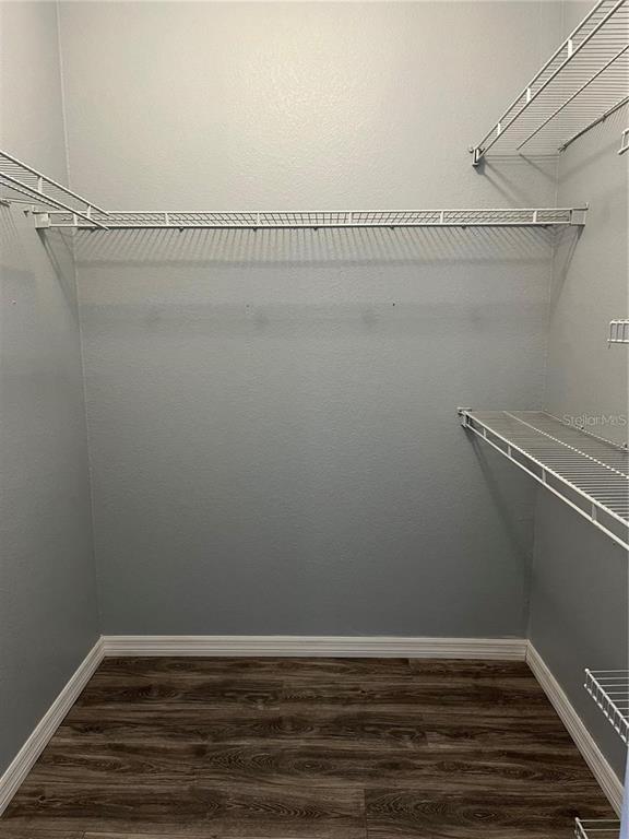 6157 Metrowest Boulevard, Unit 101 Orlando, FL 32835 - Photo 7 of 10 a view of a room with racks on the wall