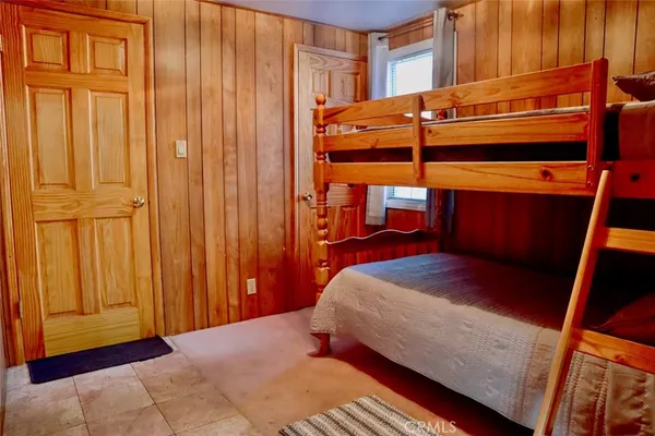 a bedroom with a bed and a closet