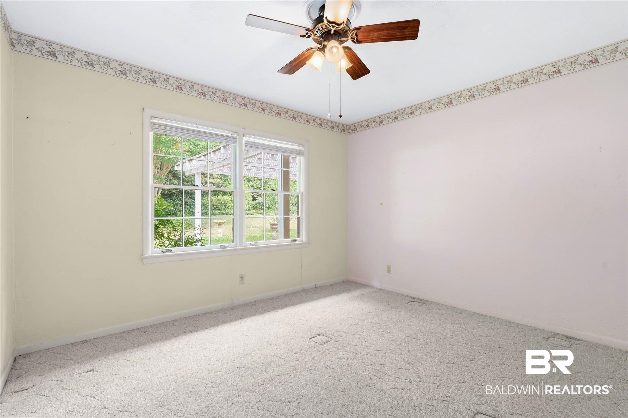 1182 Ginger Drive Mobile, AL 36693 - Photo 24 of 37 Room featuring dual windows, ceiling fan with light fixture, wall-to-wall carpeting, and a decorative wallpaper border