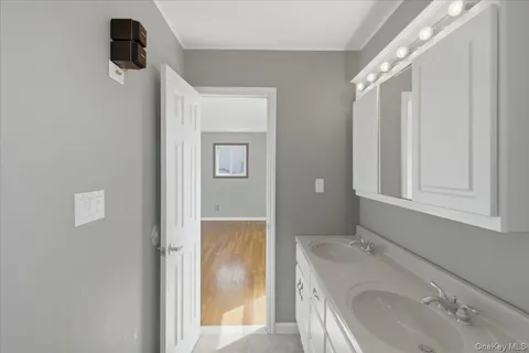 a bathroom with a sink and mirror
