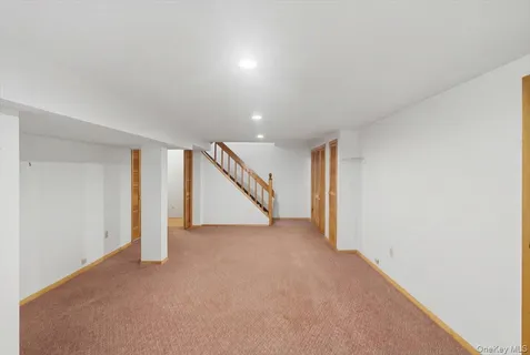 a view of an empty room with stairs