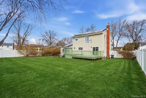 a view of a backyard with large trees