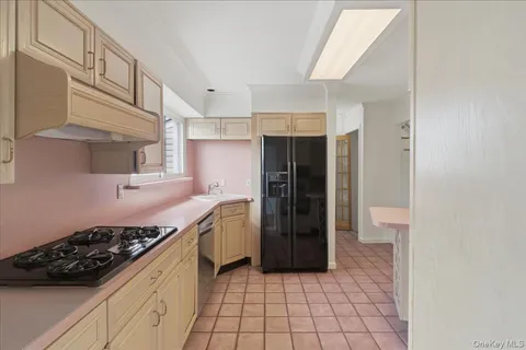 a kitchen with stainless steel appliances a stove and a refrigerator