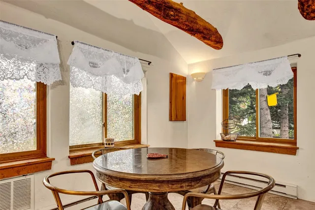 a bedroom with a bed and a table with chair