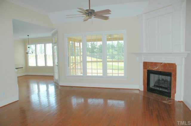613 Competition Raleigh, NC 27603 - Photo 10 of 10 a view of an empty room with exposed radiator and fireplace