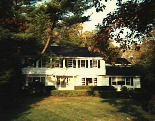 4 Duck Pond Road Norwalk, CT 06855 - Photo 1 of 1 a front view of a house with a yard