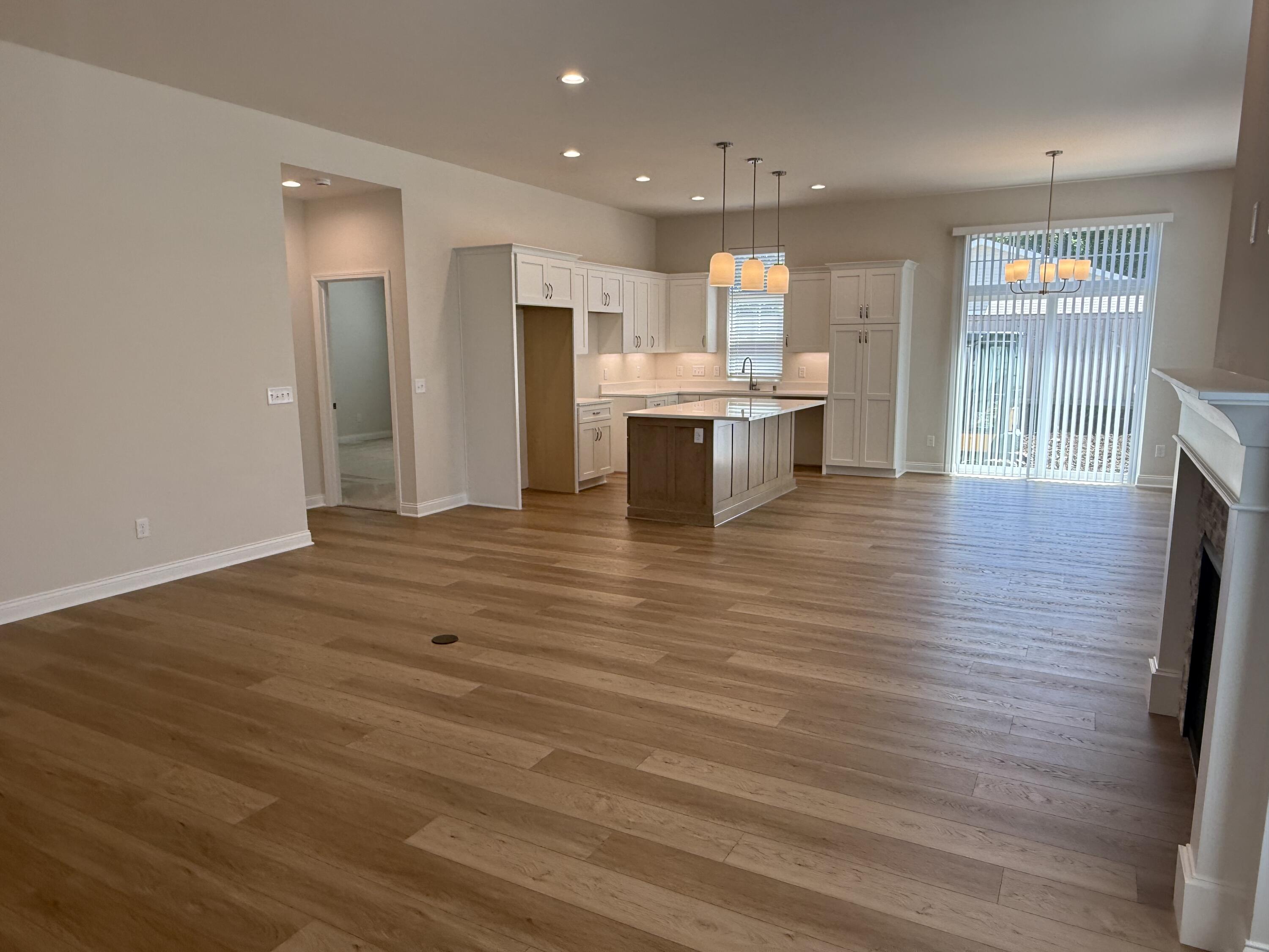 369 Evergreen Lane Pewaukee, WI 53072 - Photo 2 of 27 Great Room and Kitchen/Dining