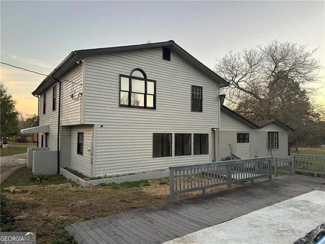 a front view of a house with garage