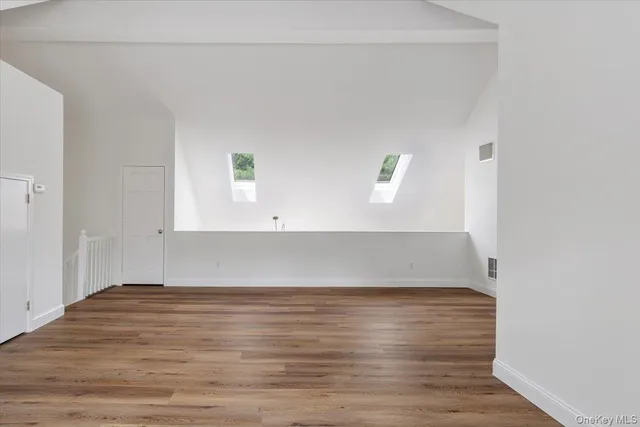 a view of room with wooden floor