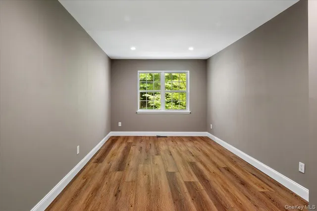 a view of room with window and ceiling fan