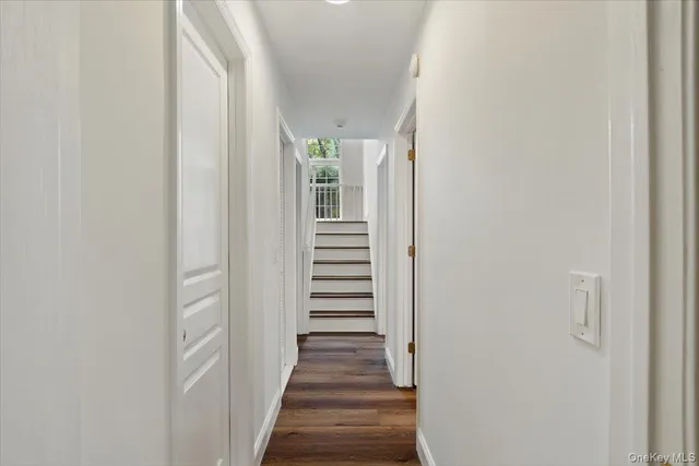 a view of a hallway with stairs