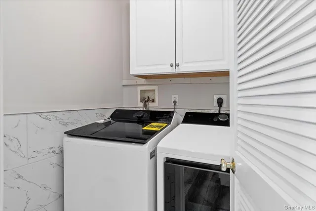 a utility room with dryer and washer
