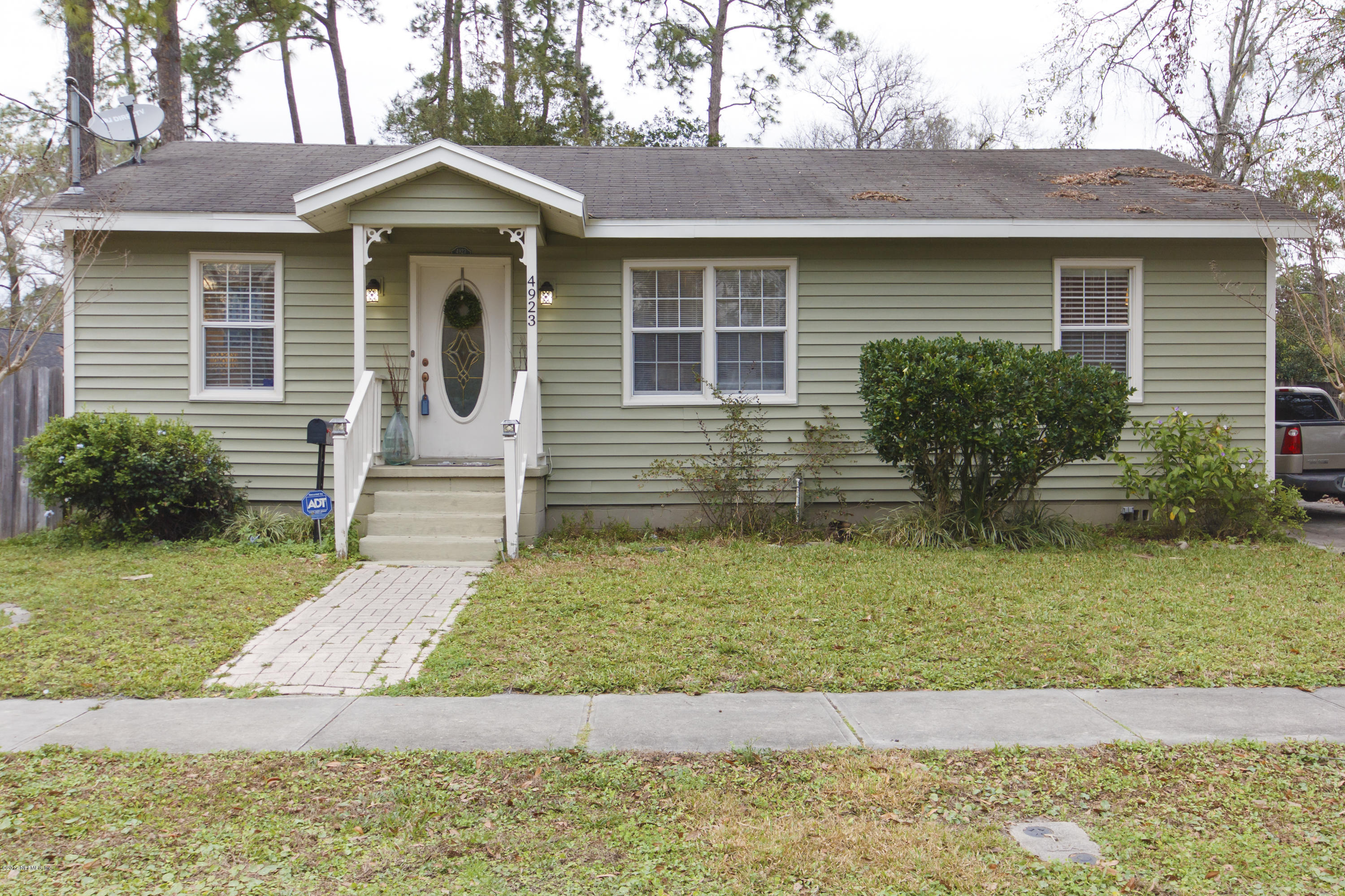 4923 Dundee Road Jacksonville, FL 32210 - Photo 2 of 14 a front view of a house with garden