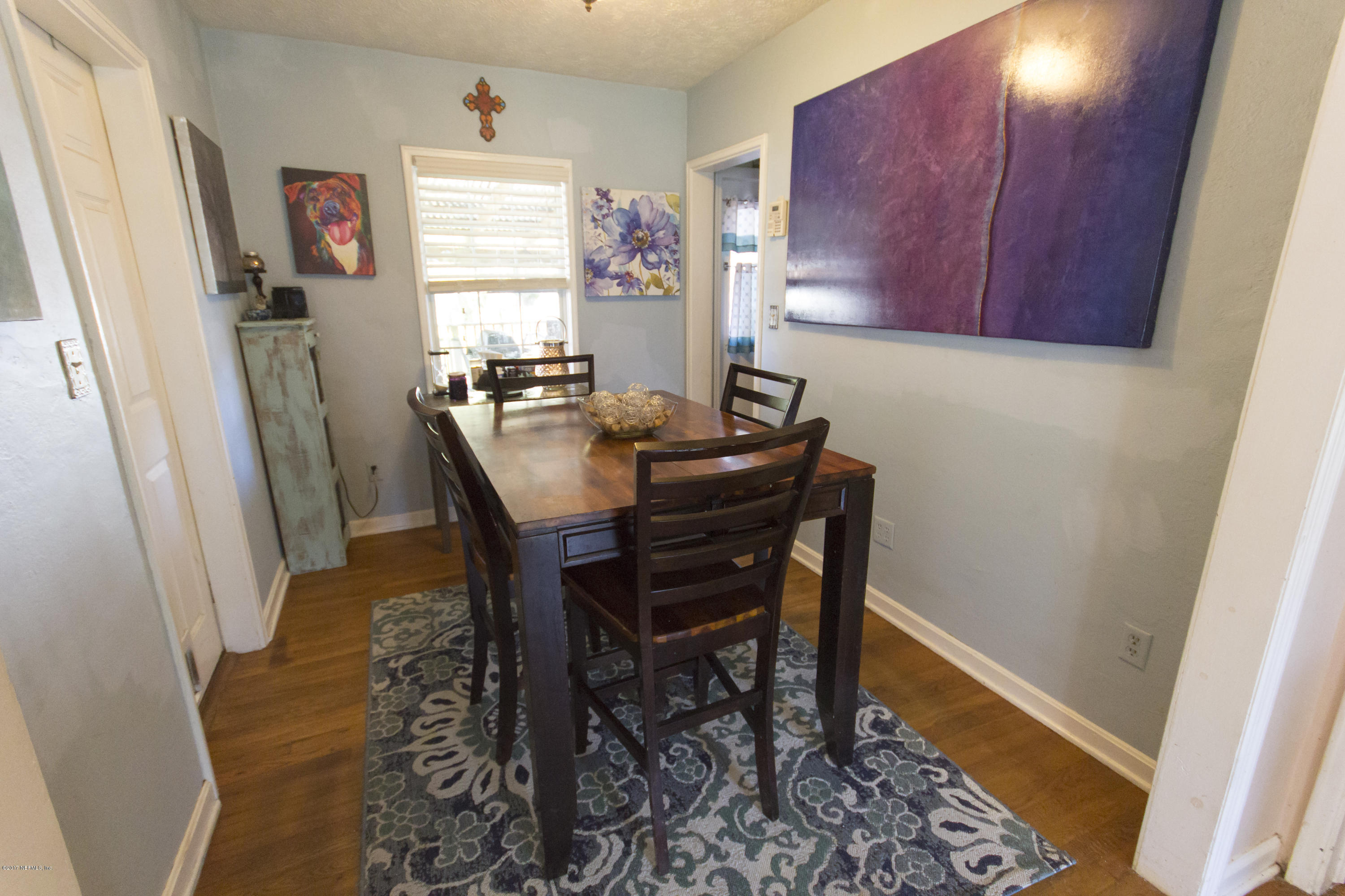 4923 Dundee Road Jacksonville, FL 32210 - Photo 6 of 14 a view of a dining room with furniture and window
