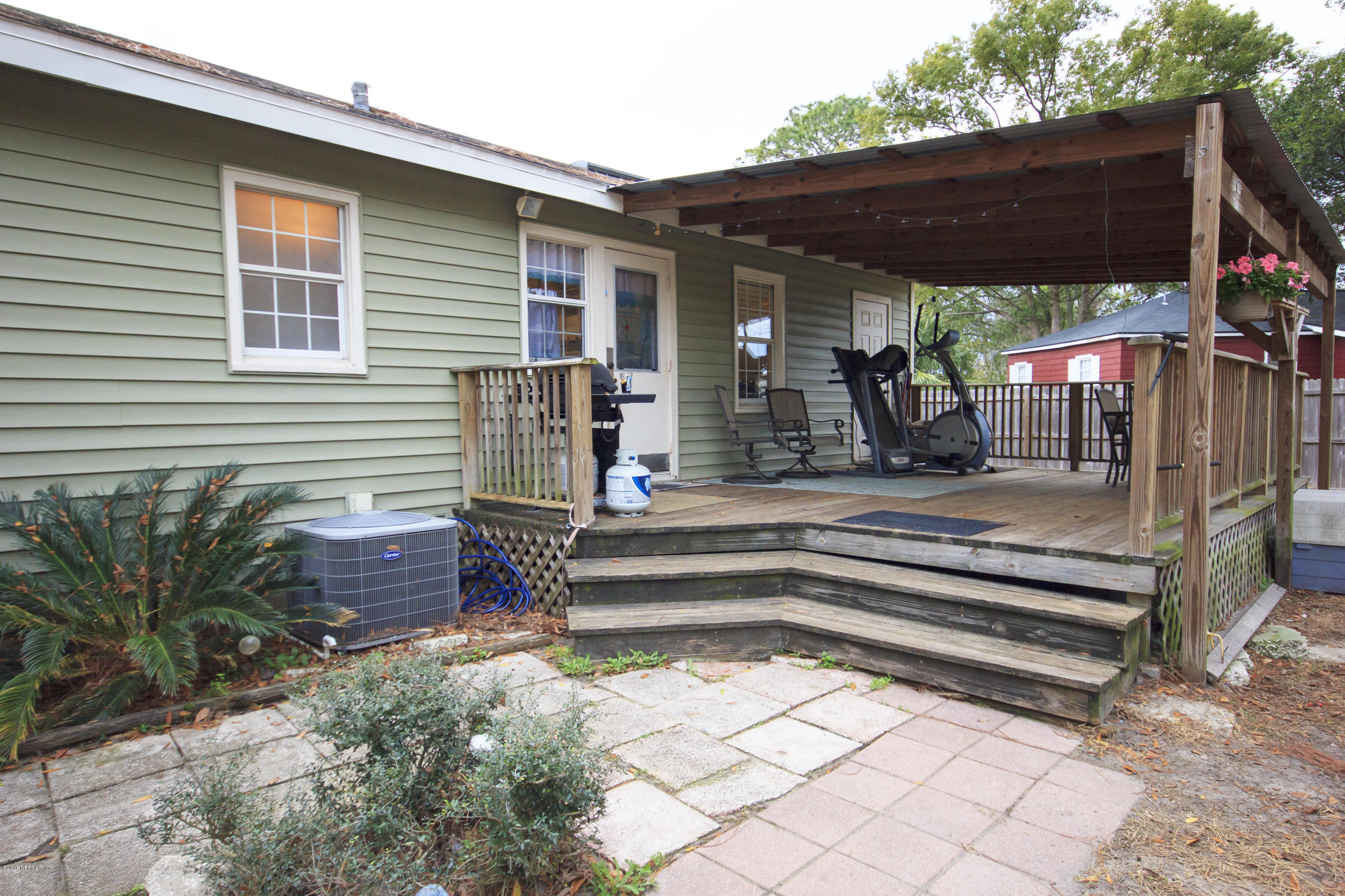 4923 Dundee Road Jacksonville, FL 32210 - Photo 10 of 14 a view of backyard with deck and outdoor seating