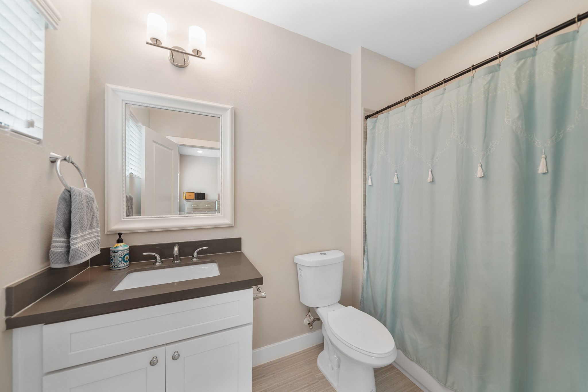 1824 Bonner Street Houston, TX 77007 - Photo 33 of 39 a bathroom with a sink a toilet and a mirror