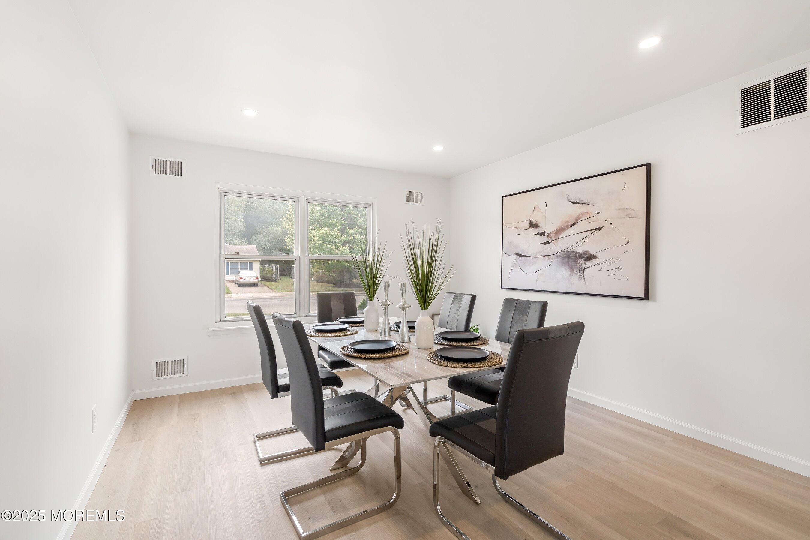 944 Yellowbank Road Toms River, NJ 08753 - Photo 12 of 33 a view of a dining room with furniture window and wooden floor