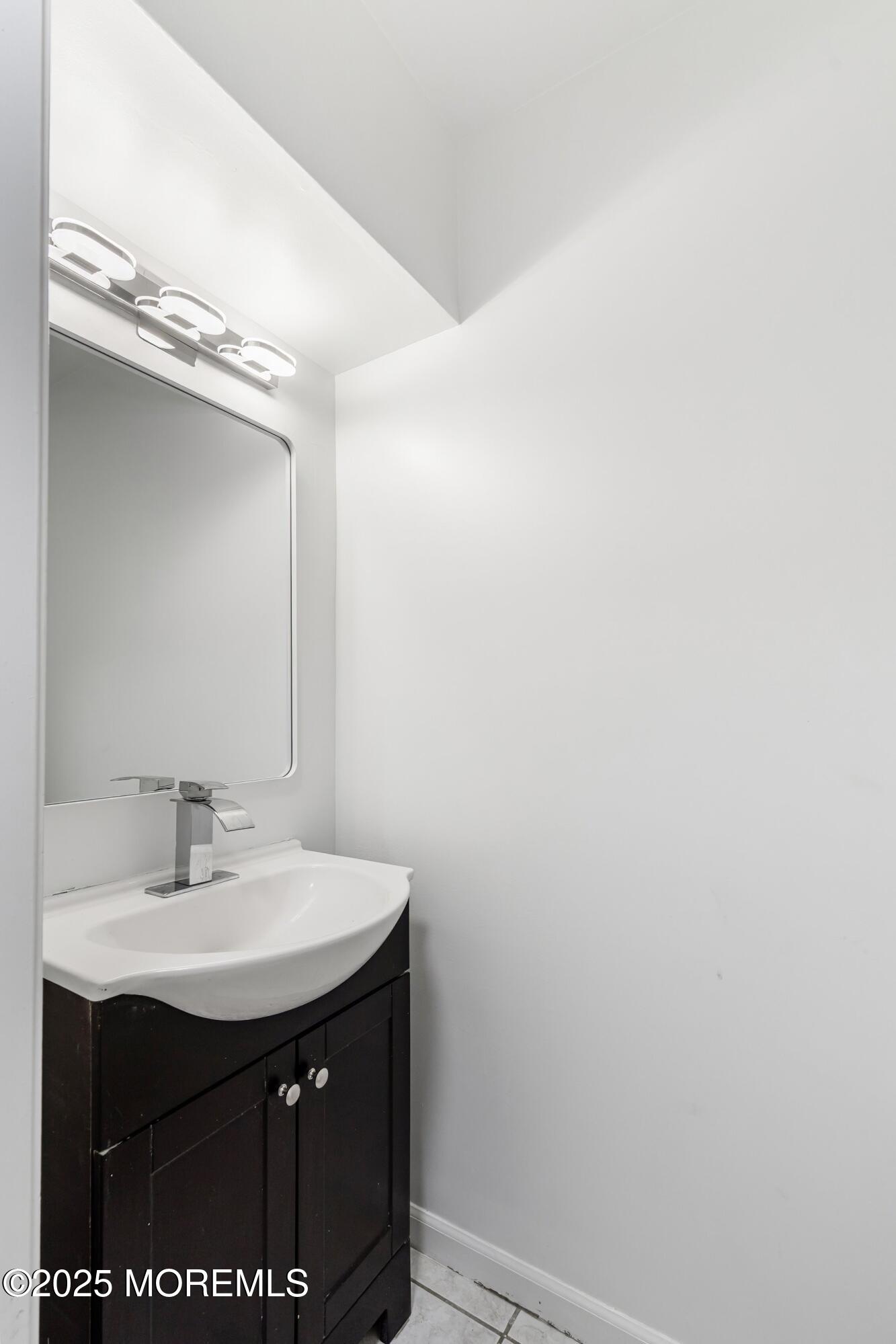 944 Yellowbank Road Toms River, NJ 08753 - Photo 14 of 33 a sink with a mirror