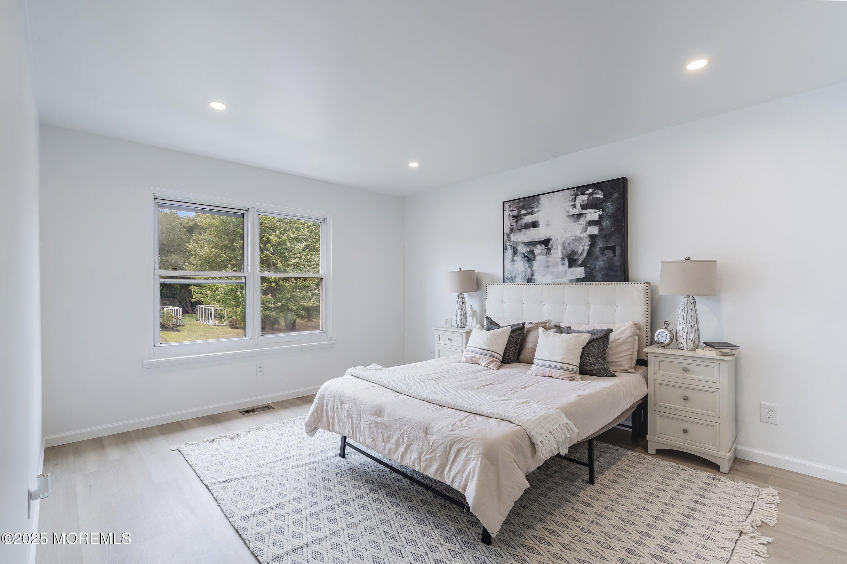944 Yellowbank Road Toms River, NJ 08753 - Photo 15 of 33 a bedroom with a large bed and a window