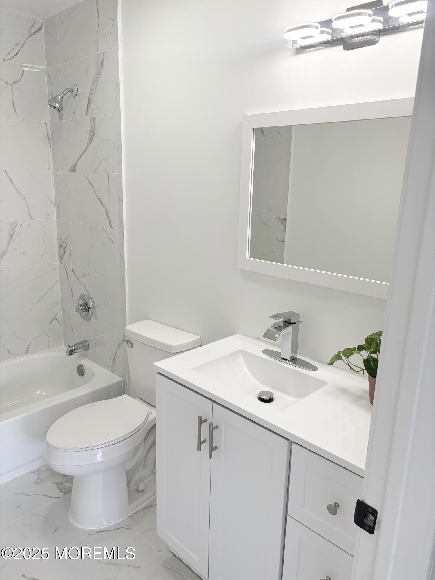 944 Yellowbank Road Toms River, NJ 08753 - Photo 18 of 33 a bathroom with a sink a toilet and shower