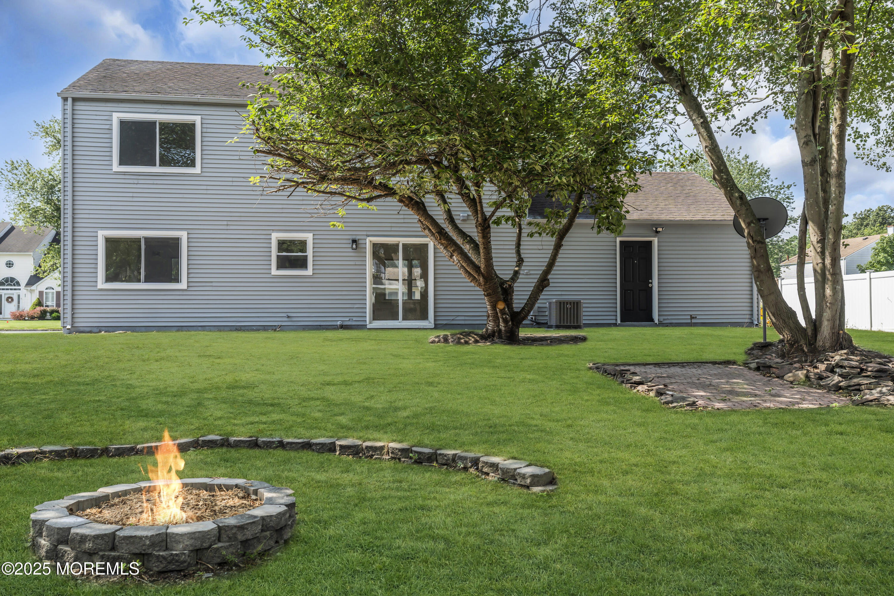 944 Yellowbank Road Toms River, NJ 08753 - Photo 2 of 33 a front view of a house with a garden
