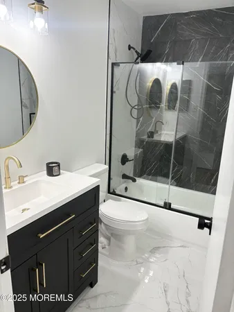 a bathroom with a sink toilet and mirror