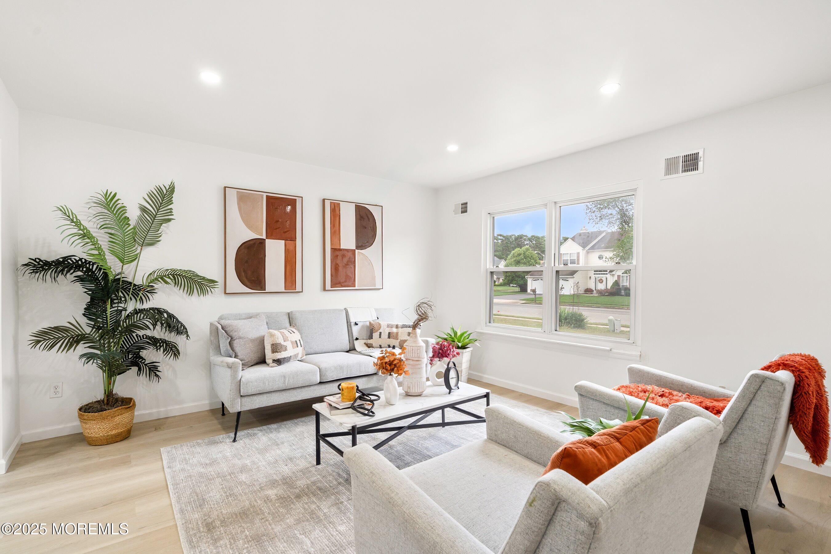 944 Yellowbank Road Toms River, NJ 08753 - Photo 3 of 33 a living room with furniture and a potted plant