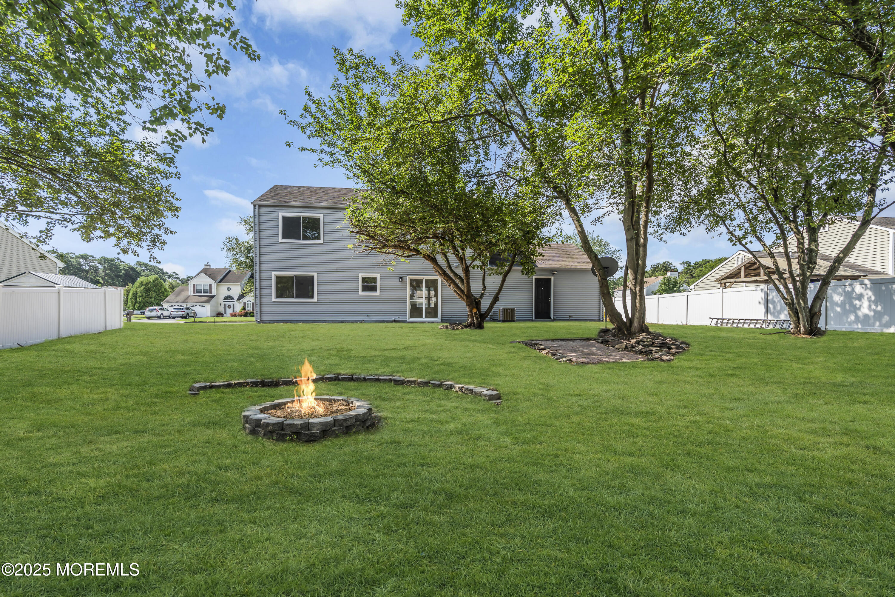 944 Yellowbank Road Toms River, NJ 08753 - Photo 33 of 33 a house with green field in front of it