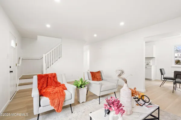 a living room with furniture and a chair