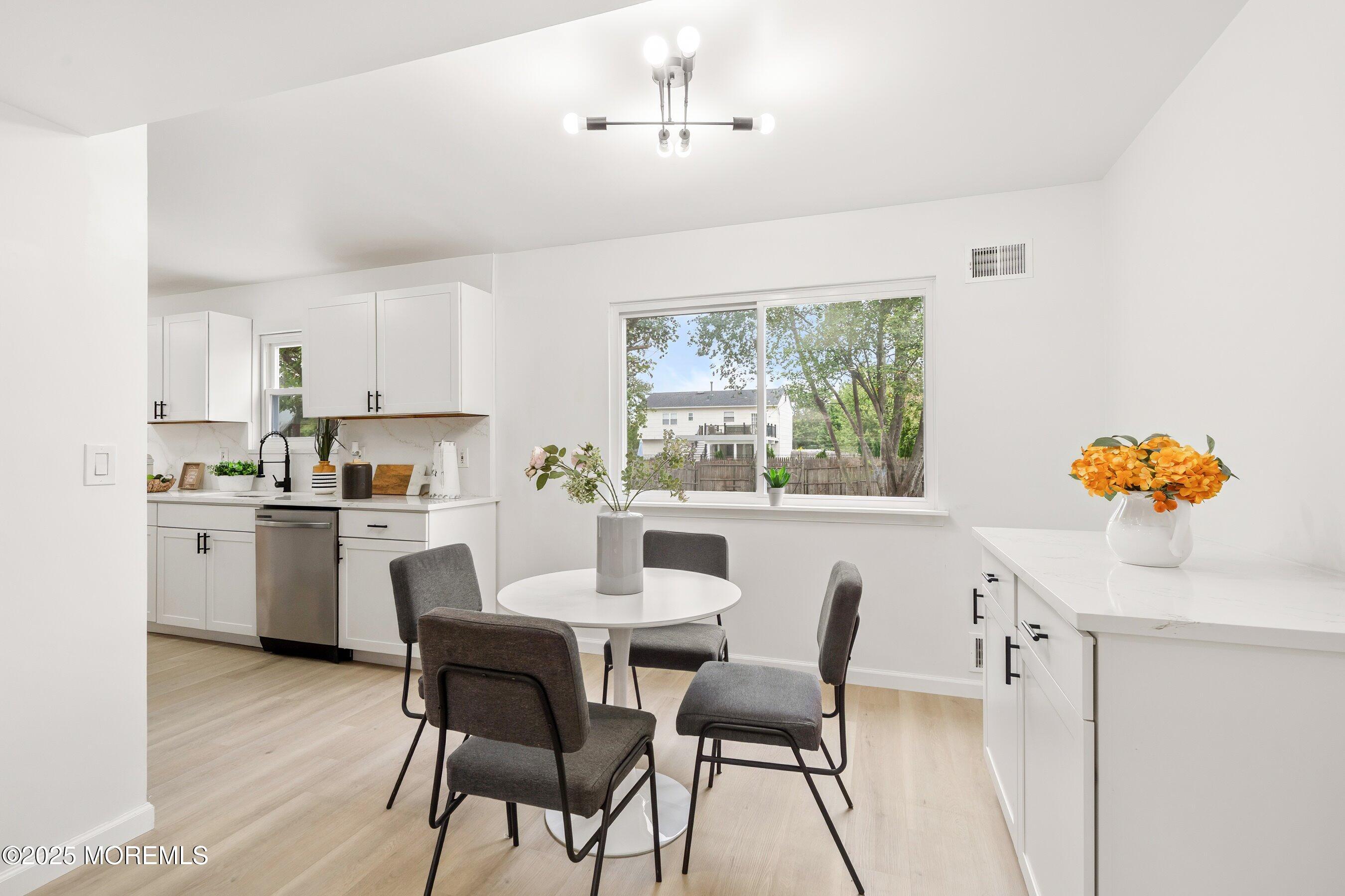 944 Yellowbank Road Toms River, NJ 08753 - Photo 10 of 33 a dining room with furniture a window and kitchen view
