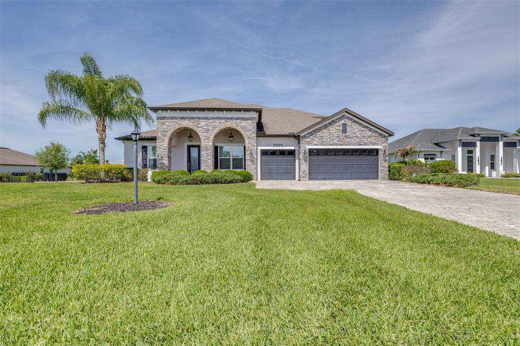 2005 149th Place East Parrish, FL 34219 - Photo 1 of 39 a front view of a house with a yard