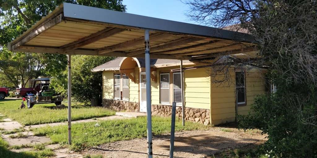 115 East Hallie Street Floydada, TX 79235 - Photo 3 of 11 a view of a car park in front of a house