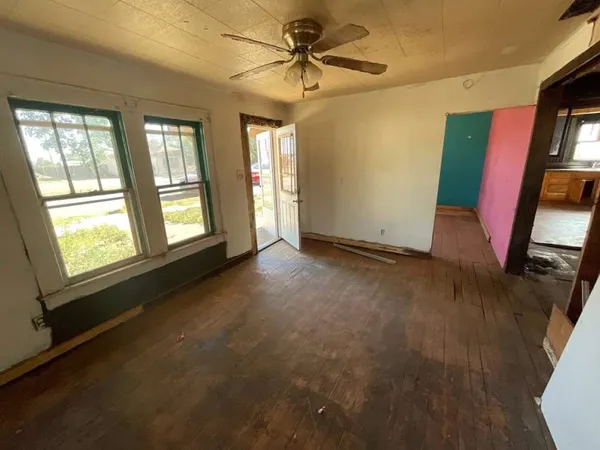 a view of an empty room with a window