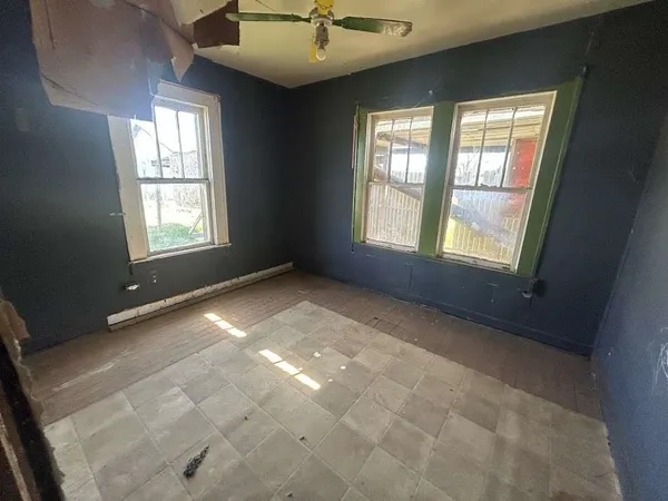 a view of an empty room with a window