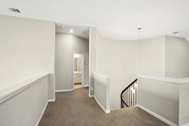 a view of a hallway with closet area