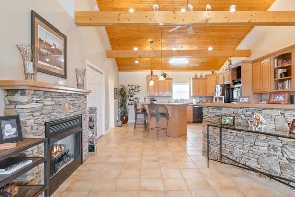 a kitchen with stainless steel appliances granite countertop a sink and cabinets