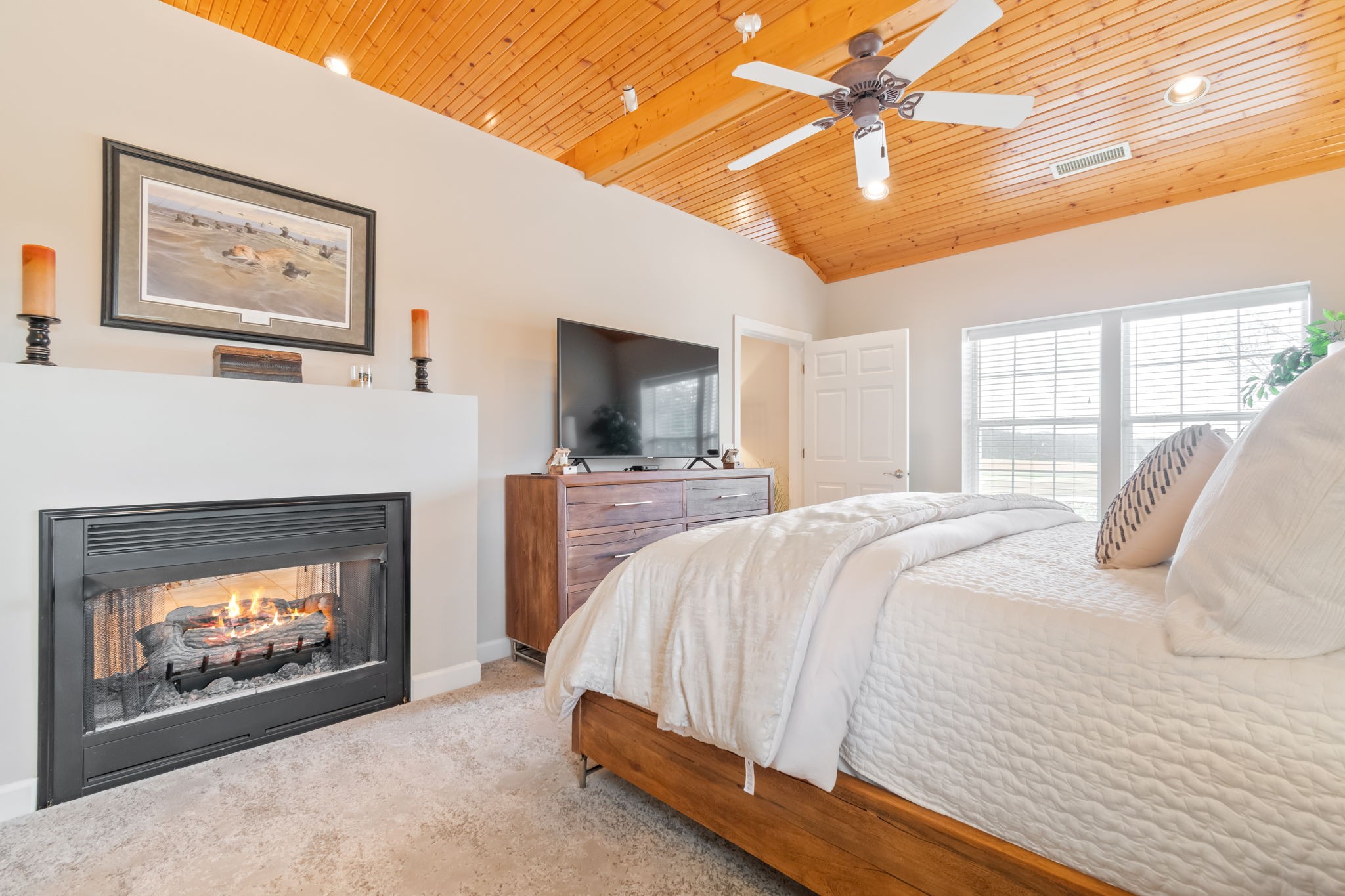 3100 Floyd Road Eagleville, TN 37060 - Photo 22 of 63 a spacious bedroom with a bed and a fireplace