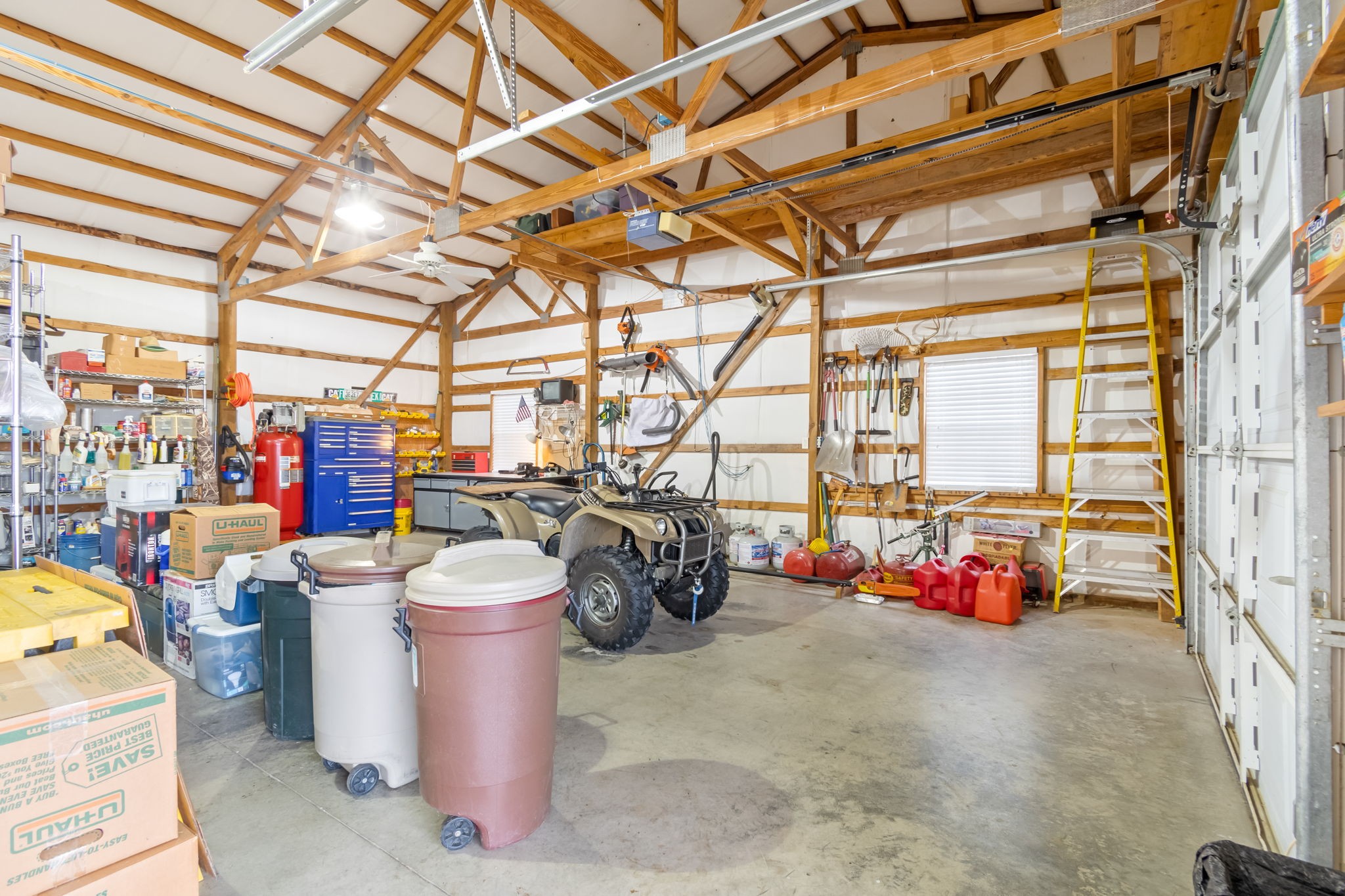 3100 Floyd Road Eagleville, TN 37060 - Photo 48 of 63 a storage room with water heater and racks on the kitchen