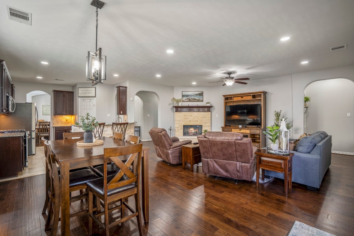 27135 Cottage Stream Lane Fulshear, TX 77441 - Photo 11 of 42 Open-concept layout connecting the kitchen, dining, and living areas - perfect for entertaining and everyday living.